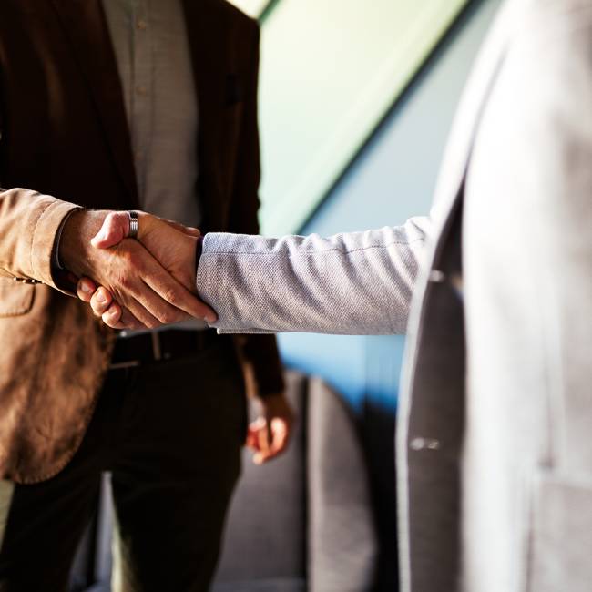 Business handshake and successful business people concept. Partnership, deal, agreement.